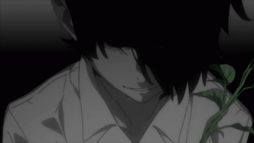 A Man In A White Shirt Is Standing In A Dark Room GIF