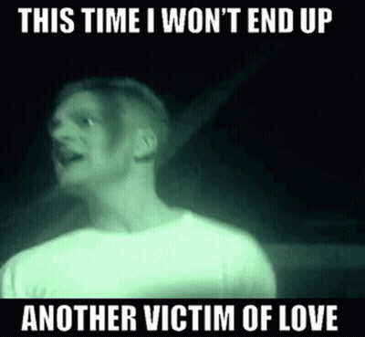 A Man In A White Shirt Is Standing In A Dark Room And Says This Time I Won 'T End Up GIF