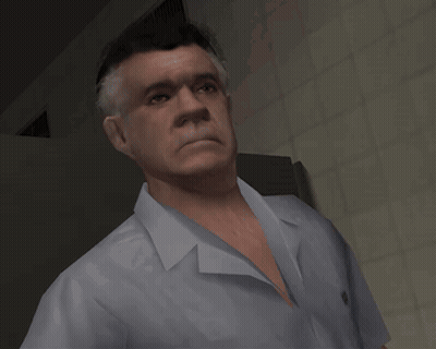 A Man In A White Shirt Is Standing In A Room GIF