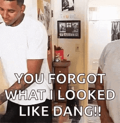 A Man In A White Shirt Is Standing In A Room And Saying `` You Forgot What I Looked Like Dang !! '' GIF
