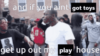 A Man In A White Shirt Is Standing In Front Of A Crowd With The Words And If You Ain T Got Toys GIF