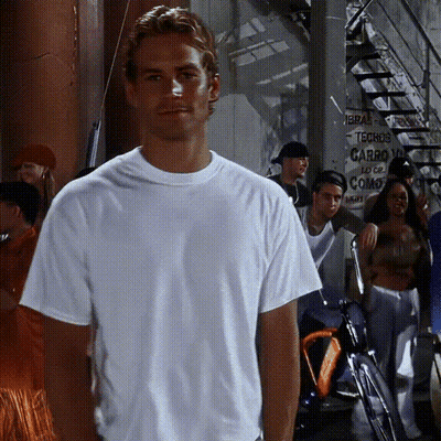 A Man In A White Shirt Is Standing In Front Of A Sign That Says Techos Carro GIF