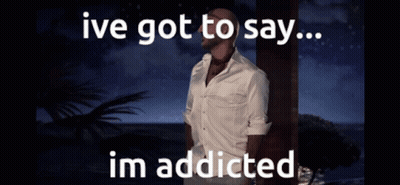 A Man In A White Shirt Is Standing In Front Of The Ocean With The Words Ive Got To Say Im Addicted GIF