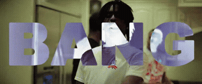 A Man In A White Shirt Is Standing In Front Of The Words Bang GIF