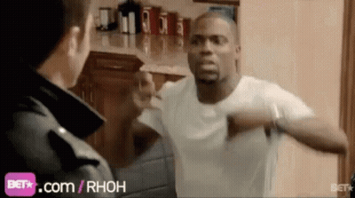 A Man In A White Shirt Is Standing Next To A Man In A Black Jacket . GIF