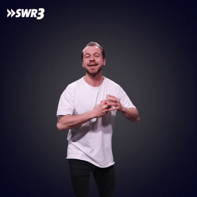 A Man In A White Shirt Is Throwing Food In The Air With Swr3 In The Corner GIF