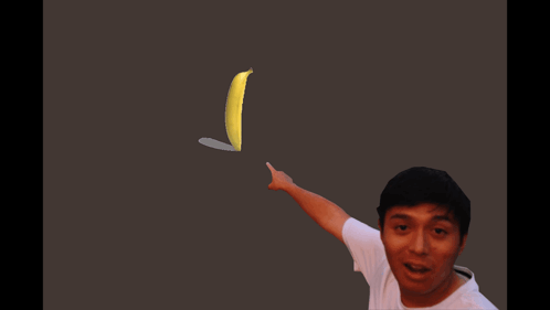 A Man In A White Shirt Points To A Banana GIF