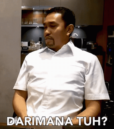 A Man In A White Shirt Says Darimana Tuh While Sitting At A Table GIF