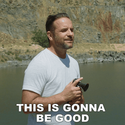 A Man In A White Shirt Stands In Front Of A Body Of Water With The Words This Is Gonna Be Good Above Him GIF