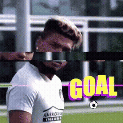 A Man In A White Shirt Stands In Front Of A Goal Sign GIF
