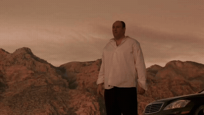 A Man In A White Shirt Stands In Front Of A Mercedes GIF