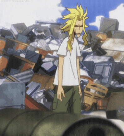 A Man In A White Shirt Stands In Front Of A Pile Of Junk GIF
