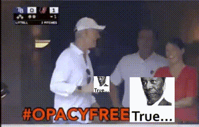a man in a white shirt stands in front of a sign that says #opacyfreetrue