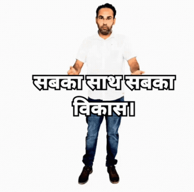 A Man In A White Shirt Stands In Front Of A Sign That Says ' Sabka Sash Sabka Vikasa ' GIF