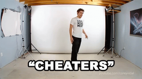 A Man In A White Shirt That Says Love Move Me Is Standing In Front Of A White Backdrop That Says " Cheaters " GIF