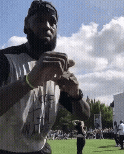A Man In A White Shirt That Says More Than An Athlete GIF
