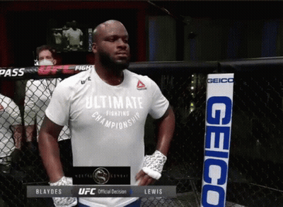 A Man In A White Shirt That Says Ultimate Championship GIF