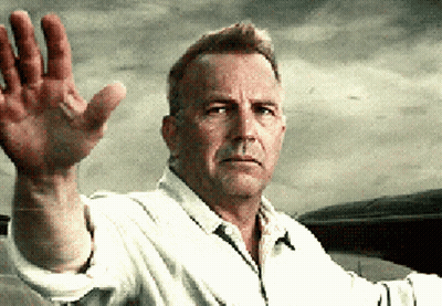 A Man In A White Shirt Waves His Hand In The Air GIF