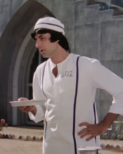 A Man In A White Shirt With 602 On It GIF