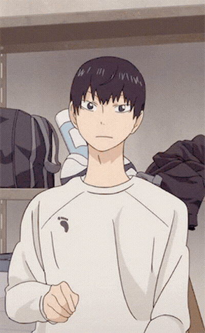 A Man In A White Shirt With A Bird On The Front GIF