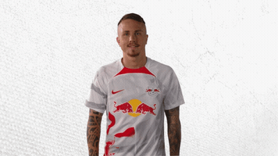 A Man In A White Shirt With Red Bulls On It GIF