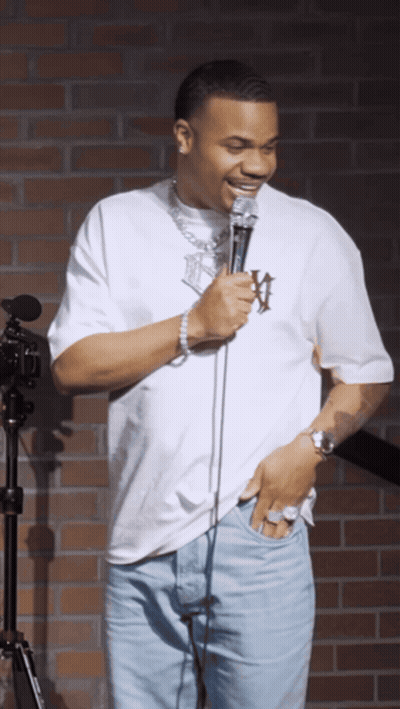 A Man In A White Shirt With The Letter W On It GIF