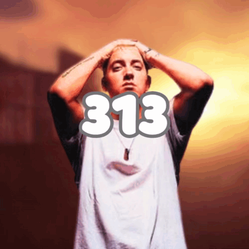 A Man In A White Shirt With The Number 313 On It GIF