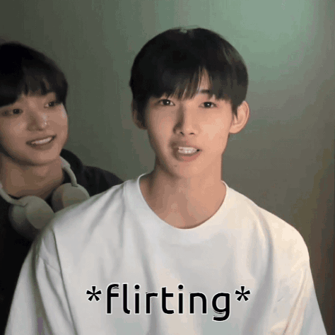 A Man In A White Shirt With The Word Flirting Written On It GIF