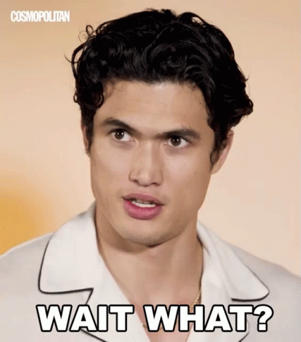 A Man In A White Shirt With The Words Wait What On His Face GIF