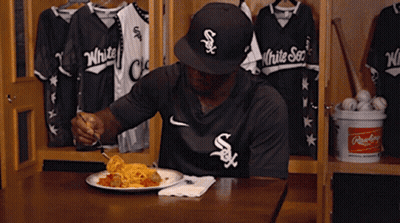 A Man In A White Sox Jersey Is Eating Spaghetti GIF
