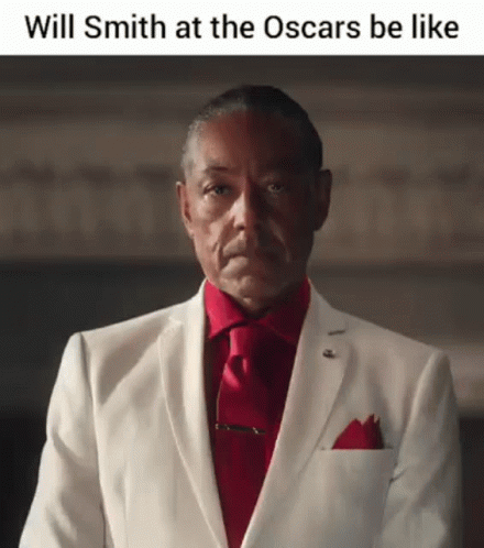 A Man In A White Suit And Red Tie Says Will Smith At The Oscars Be Like .. GIF