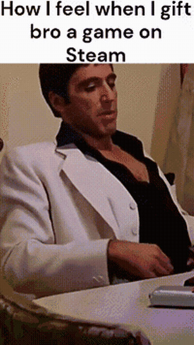 A Man In A White Suit Is Sitting At A Desk With A Laptop And A Text That Says How I Feel GIF