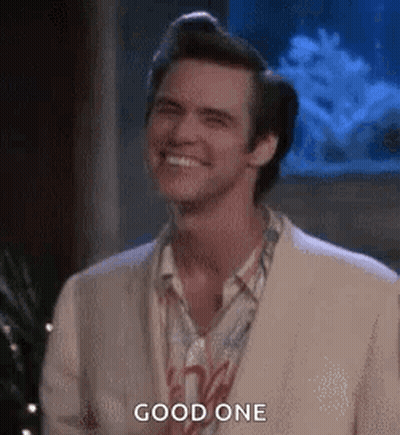 A Man In A White Suit Is Smiling And Says `` Good One '' . GIF