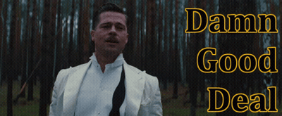 A Man In A White Suit Is Standing In A Forest With The Words Damn Good Deal Above Him GIF