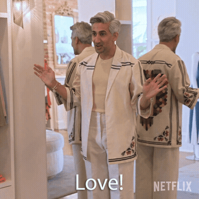 A Man In A White Suit Says " Love " GIF