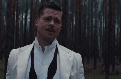 A Man In A White Suit Stands In Front Of A Forest With The Words To Si Nemyslim Written Below Him GIF