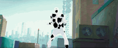 A Man In A White Suit With Black Spots Is Standing In A City GIF