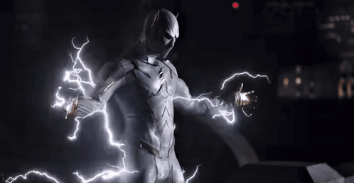 A Man In A White Superhero Costume Is Surrounded By Lightning GIF