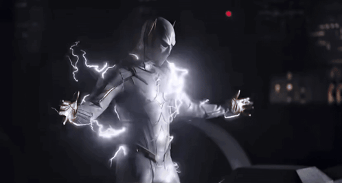 A Man In A White Superhero Suit Is Surrounded By Lightning Bolts GIF