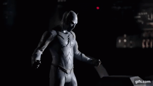 A Man In A White Superhero Suit Is Surrounded By Lightning Bolts . GIF