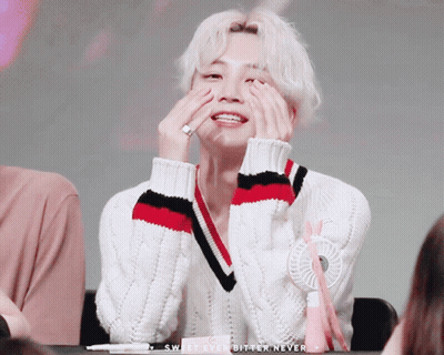 A Man In A White Sweater Covering His Face With His Hands With The Words Sweet Ever Bitter Never Below Him GIF