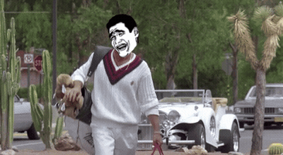 A Man In A White Sweater Is Walking A Dog With A Stop Sign Behind Him GIF