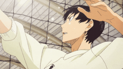 A Man In A White Sweatshirt With A Footprint On It Is Jumping Over A Volleyball Net GIF