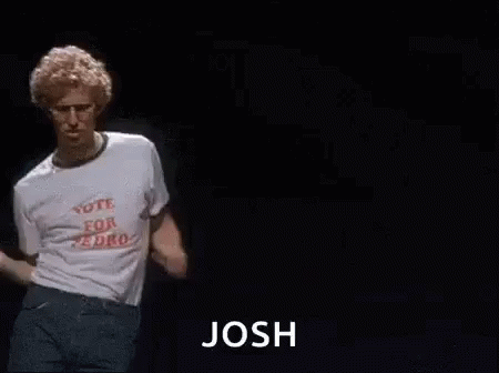 A Man In A White T-Shirt Is Dancing On A Stage With The Word Josh . GIF