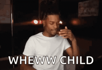 A Man In A White T-Shirt Is Making A Funny Face While Holding A Cigarette In His Hand . GIF