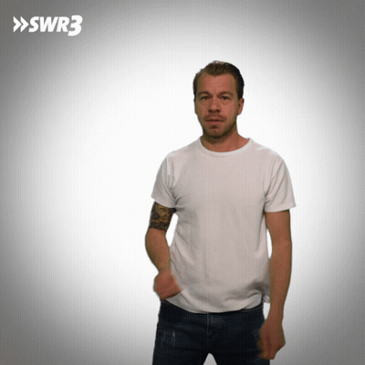 A Man In A White T-Shirt Is Standing In Front Of A White Background With Swr3 Written On It GIF