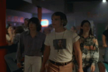A Man In A White T-Shirt With A Picture Of A Man On It GIF