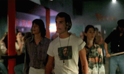 A Man In A White T-Shirt With A Picture Of A Man On It GIF