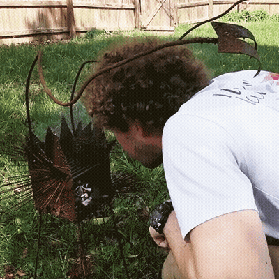 A Man In A White T-Shirt With The Word Love On It GIF