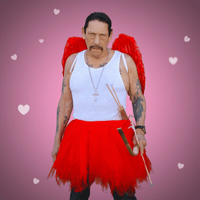 A Man In A White Tank Top And A Red Skirt Is Holding An Arrow GIF